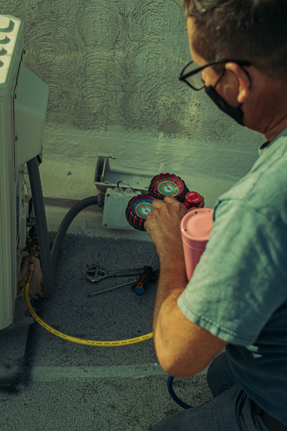 Technician performing a seasonal AC service